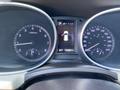 Dashboard of a 2018 Hyundai Santa Fe showing speedometer tachometer and fuel gauge with a digital display indicating parking and odometer reading