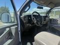 Interior view of a 2017 Chevrolet Express showing the driver's seat dashboard and steering wheel