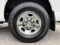A close-up of a chrome wheel rim featuring a Chevrolet emblem with a Michelin tire labeled LTX A/T mounted on it