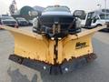 A 2016 RAM 5500 truck equipped with a yellow snow plow adorned with rust and a Meyer logo on the front