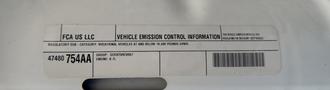 A 2016 RAM 5500 truck displaying a vehicle emission control information label with details including regulatory subcategory and group information