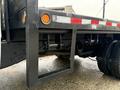 A 2008 Sterling Bullet truck featuring a flatbed with hitch and suspension components visible near the rear wheels
