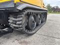A 2004 Bombardier SW48 showing a close-up of its rugged tracks and wheels designed for off-road traction and stability