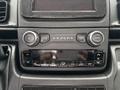 Dashboard controls of a 2023 RAM Promaster 3500 featuring buttons for volume mute air conditioning and a screen display