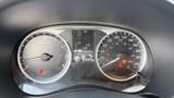 The dashboard of a 2019 Nissan Kicks displaying speedometer fuel gauge and various warning indicators