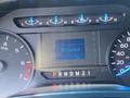 Dashboard display of a 2017 Ford F-250 SD showing speedometer fuel gauge and odometer with readings in kilometers