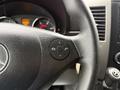 Close-up of the steering wheel of a 2017 Mercedes-Benz Sprinter featuring buttons for audio control and phone functions