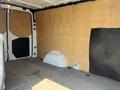 Interior of a 2022 Mercedes-Benz Sprinter van with wooden walls and a spacious cargo area