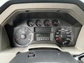 Dashboard of a 2009 Ford F-550 featuring gauges for speedometer fuel level tachometer and digital display showing odometer reading