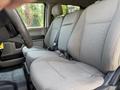 Interior view of a 2020 Ford F-350 SD showing two front seats with gray upholstery and seat belts