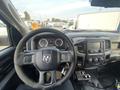 Interior view of a 2016 RAM 5500 showing the steering wheel dashboard and central console with various controls and displays