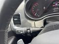 A close-up view of the steering wheel controls in a 2015 Dodge Durango showing the wiper control lever and dashboard display