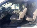 Interior of a 2017 Ford F-150 featuring front seats with cloth upholstery and a spacious layout including a central console and multiple seats in a row