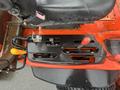 Detail of the control panel of a 2010 Kubota F3680 with levers for gear selection and hydraulic functions