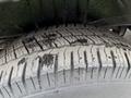 Close-up of a worn tire from a 2012 Mercedes-Benz Sprinter showing tread patterns and surface wear