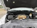 A 2016 RAM 1500 engine bay with visible components including the engine, coolant reservoir, and air intake system