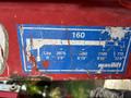 A weathered blue and white label showing specifications for a Maxilift including weight capacities and extended lengths labeled 160 and various measurements