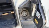 Close-up of the fuel filler neck and cap of a 2021 Ford Transit showing the circular opening and gas cap inside