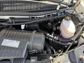 The image shows the engine compartment of a 2017 Chevrolet Express with visible components such as the air intake manifold hoses and fluid containers