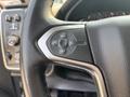 Steering wheel control panel of a 2017 Chevrolet Silverado 1500 featuring buttons for cruise control settings