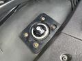 A close-up view of a black ignition switch panel with a circular keyhole and a labeled dial for on and off positions in a 2015 Freightliner M2