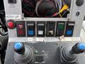 Control panel with various switches and levers for a 2016 RAM 5500 including buttons labeled for body lift camera brine valve and plow lights