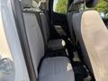 Interior view of a 2017 Chevrolet Colorado showing the back row of seats with light gray upholstery and ample legroom