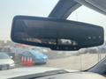 Rearview mirror of a 2017 Chevrolet Silverado 1500 with buttons for various functions