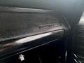 Close-up of the dashboard of a 1968 Ford Mustang Two Door Convertible showcasing the Mustang logo on the glove compartment handle