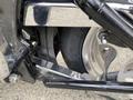 A close-up of the rear wheel and suspension of a 2008 Harley-Davidson FLSTFI showcasing chrome accents and the tire mounted on the wheel assembly