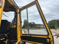 A yellow 2004 Bombardier SW48 with its door ajar showcasing the interior features and seating arrangements