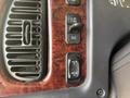 Controls and buttons on the dashboard of a 2022 Freightliner M2 106 including a fan adjustment switch and an increment decrement button