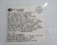 A 2020 Chevrolet Express van with a vehicle information label detailing specifications and capacity such as weight and seating arrangements