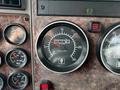 Dashboard of a 2008 Kenworth T370 showing various gauges including a tachometer and hour meter with readings