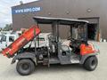 A 2011 Kubota RTV 1140 CPX utility vehicle featuring a grey chassis and an orange dump bed attached to the back with a driver seat and passenger seats in the front cabin area