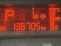 Dashboard display of a 2019 Hino 195 showing a parking indicator average miles per gallon and total distance of 136705 kilometers