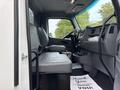 Interior view of a 2025 Peterbilt 536 truck showing driver and passenger seats and dashboard with controls