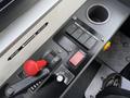 Close-up of the control panel of a 2016 Grande West Vicinity bus featuring switches a lever and a cup holder