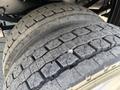 Close-up view of the tires on a 2019 Ford F-550 showing detailed tread patterns and worn surfaces
