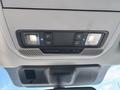 Interior overhead console of a 2021 Ford F-150 with light buttons and air circulation controls