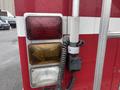 Close-up of the rear lights and a communication device on a red 2006 E-One Typhoon fire truck