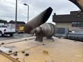 A 2015 Vermeer Corporation BC1200XL chipper with a large exhaust pipe mounted on top