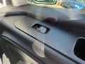 Close-up of a 2023 Mercedes-Benz Sprinter 2500 door control panel featuring a power window switch
