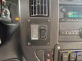 Dashboard control panel of a 2020 Chevrolet Express featuring switches for power level and interior light along with various buttons for radio and other functions