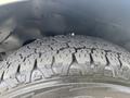 Close-up of a tire from a 2020 Chevrolet Express showing detailed tread pattern and sidewall design