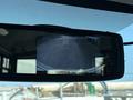 Rearview mirror display showing the backup camera feed of a 2020 Chevrolet Express van