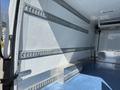 Interior view of a 2016 Mercedes-Benz Sprinter showing metal shelving and a blue floor with a step at the back of the cargo area