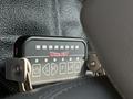 A control panel labeled Whelen with buttons for left right front and rear lights mounted inside a vehicle