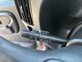 Close-up of the turn signal and wiper control lever in a 2007 GMC C4500 TopKick showing buttons for turn signals and wipers
