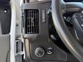 Dashboard controls of a 2014 Chevrolet Express showing air vent and various buttons for lights and features